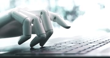 Robot hand using laptop