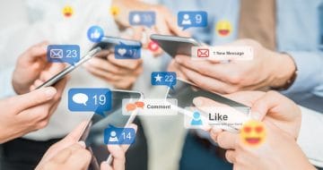 People using social media on their mobile phones