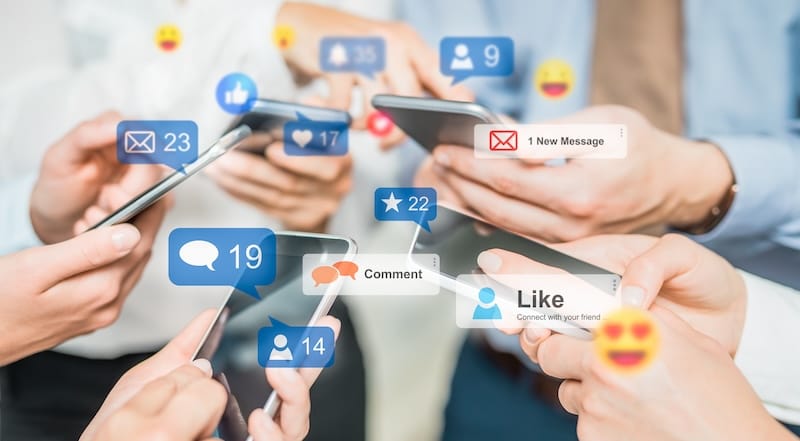 People using social media on their mobile phones