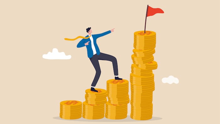 Man climbing up coins